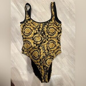Versace one piece swimsuit , never worn without tags , size small (1)
